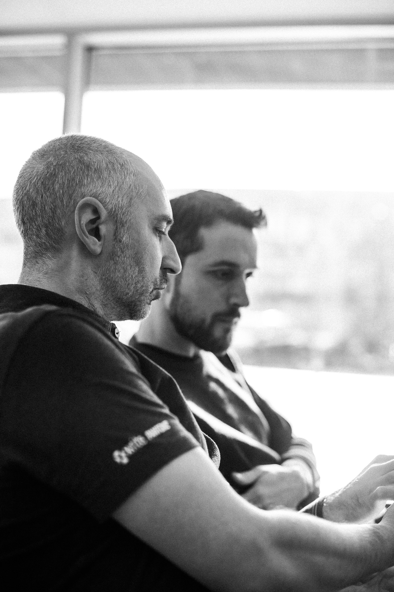 Two Rutherford engineers reviewing color data